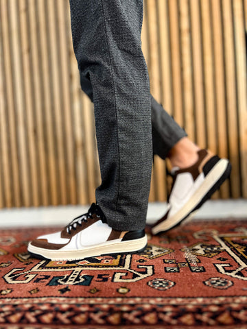 The Bullboxer 7LT0010101 1135 White-Dark Brown Leather Men's Sneaker is a great mix of casual and classy. With a clean white leather design and dark brown details, it’s easy to pair with any outfit, whether you’re running errands or heading out with friends.