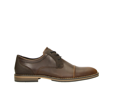 The Bullboxer 7ZZ1370301 3535 Dark Brown-Dark Brown PU Men's Shoe combines timeless style with practical comfort. Featuring a rich dark brown finish, this versatile shoe is ideal for work, formal occasions, or adding a sophisticated touch to casual looks.